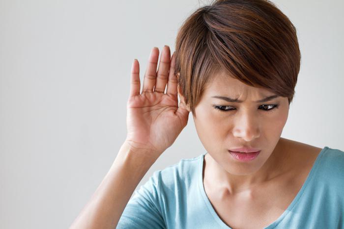 Woman having a hard time hearing