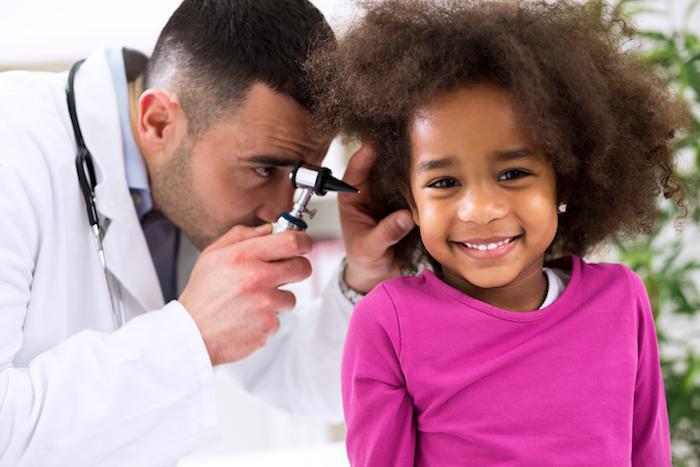 Child having ear examined