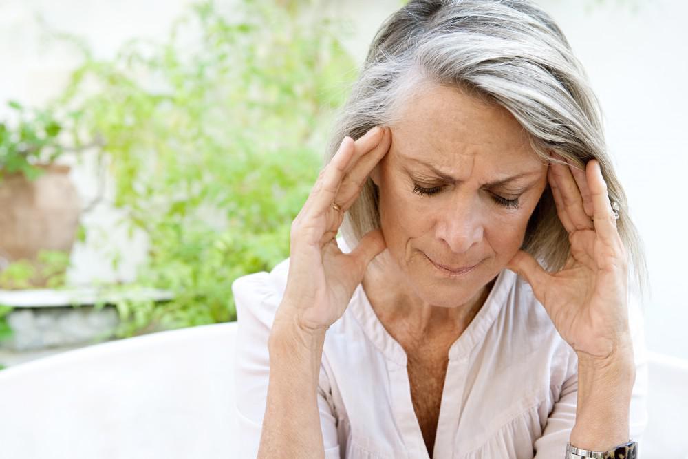 Woman experiencing a headache