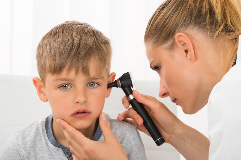 Child having ear examined