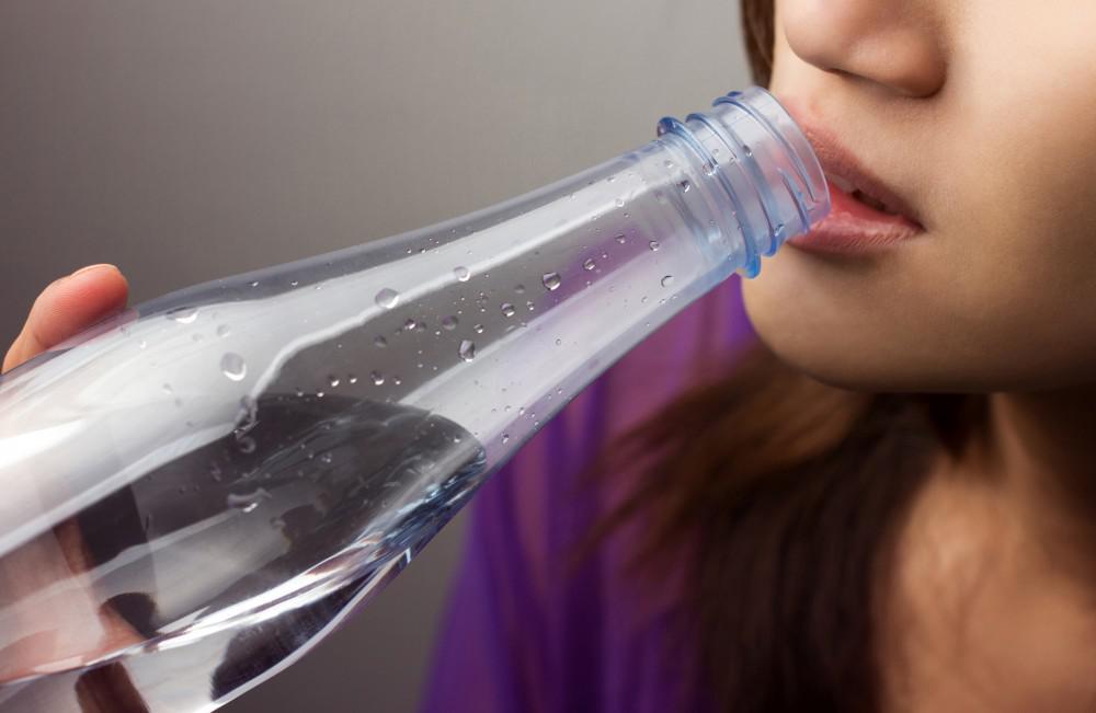 Woman drinking from a bottle