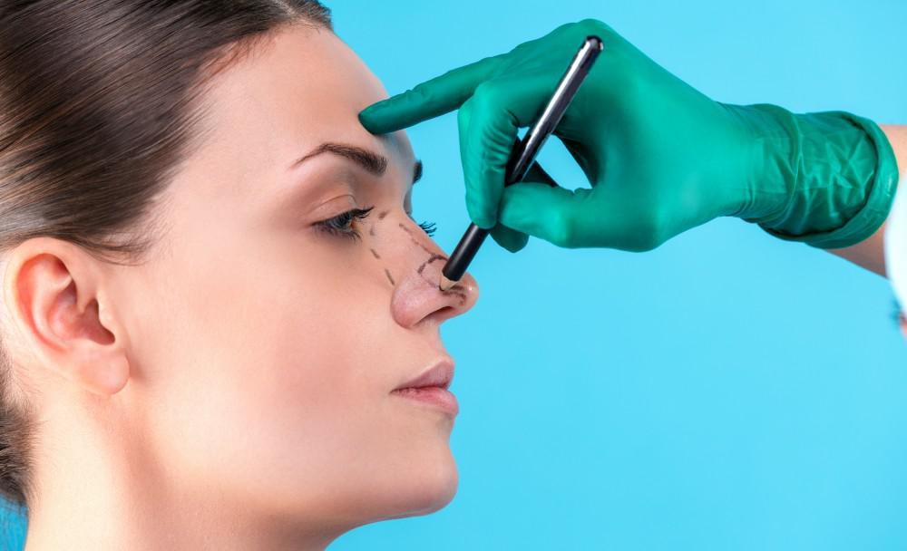 Woman having her nose marked for plastic surgery