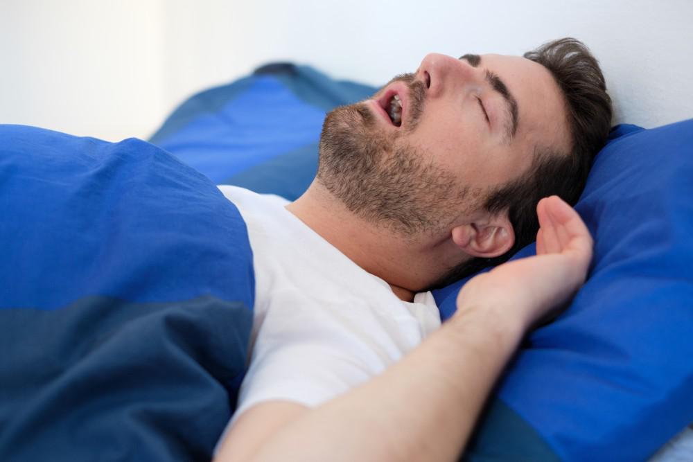 Man sleeping with his mouth open