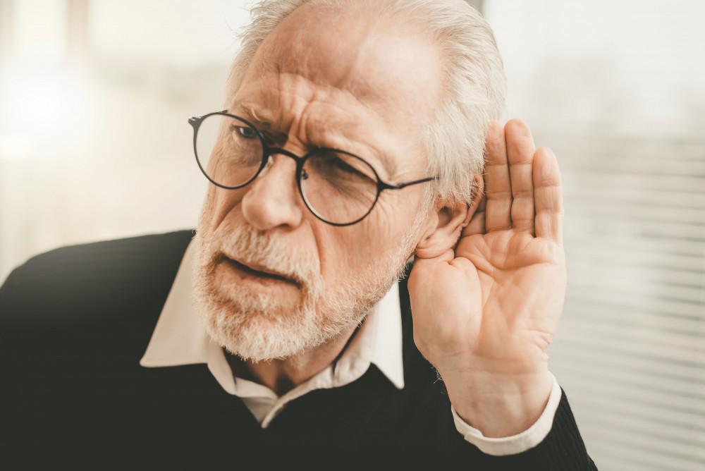 Man having a hard time hearing