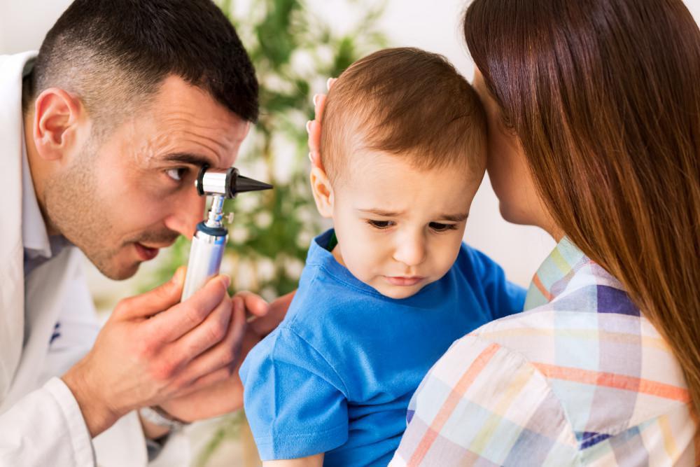 Child having ear examined