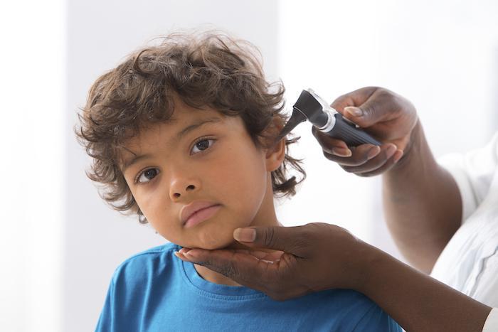 Child having ear examined