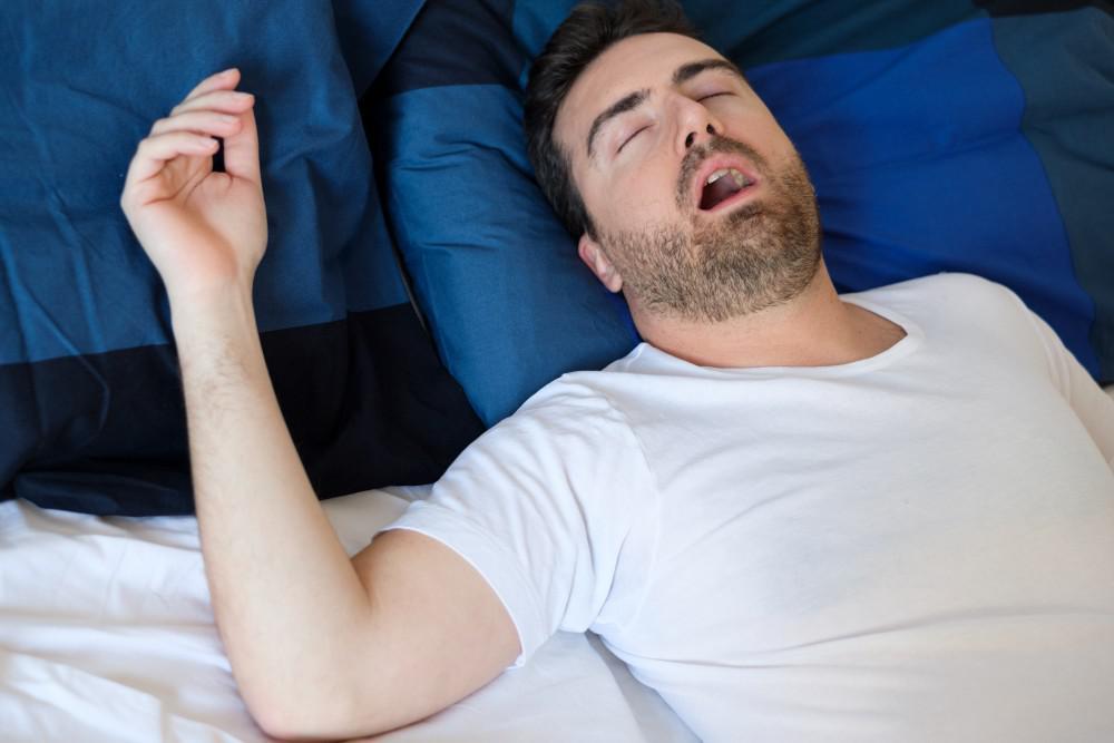 Man sleeping with his mouth open