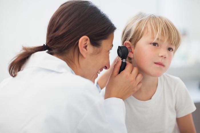 Child having ear examined
