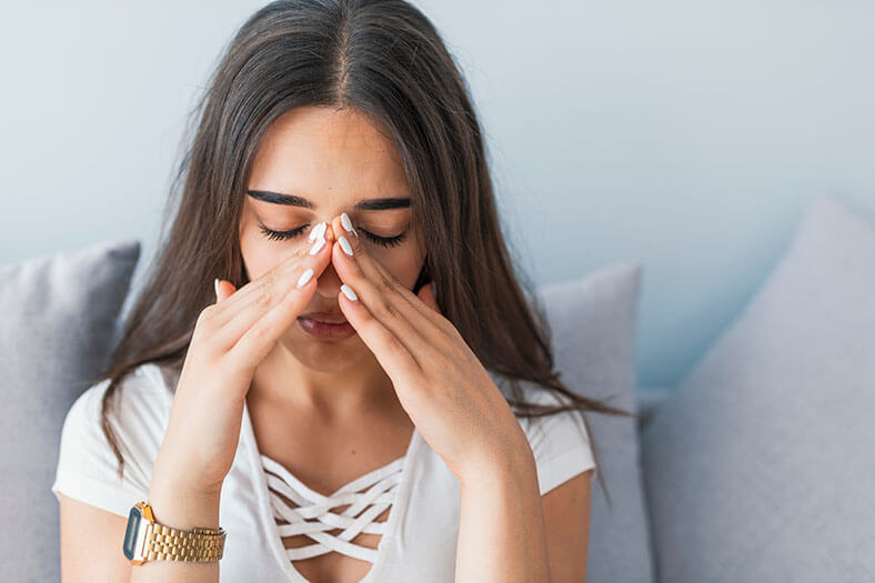 Woman Experiencing Sinus Pain