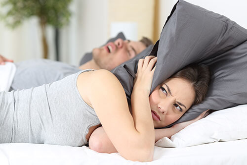 Woman Annoyed by Partners Snoring