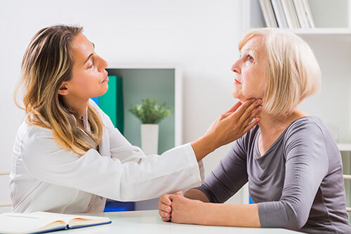 Doctor Giving a Patient Voice Therapy